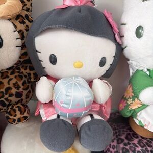 Sanrio Hello Kitty Plush in Gray Hood with Pink Outfit and Light Blue Ball